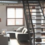 Interior view of living space with stairs up to loft.