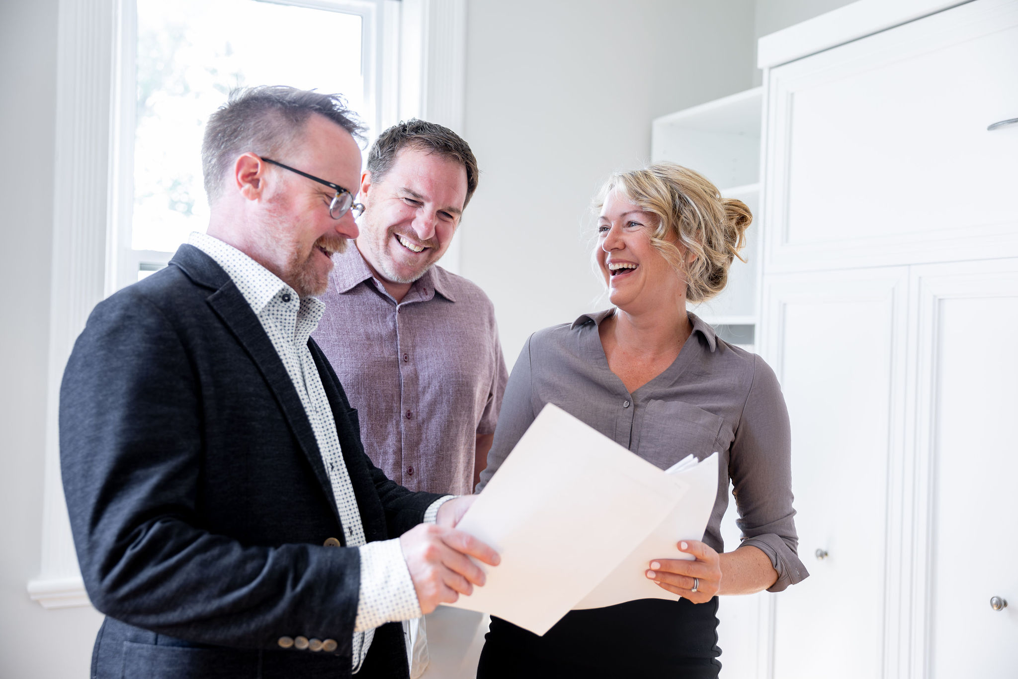 Patrick McAuley, Todd Cook and Chantel Westerman of McAuley Real Estate Group
